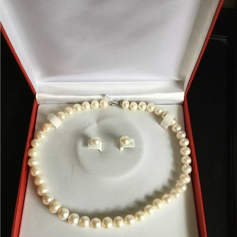 Pearl necklace, pierced ears,silver clasp, 17”l, 8”drop